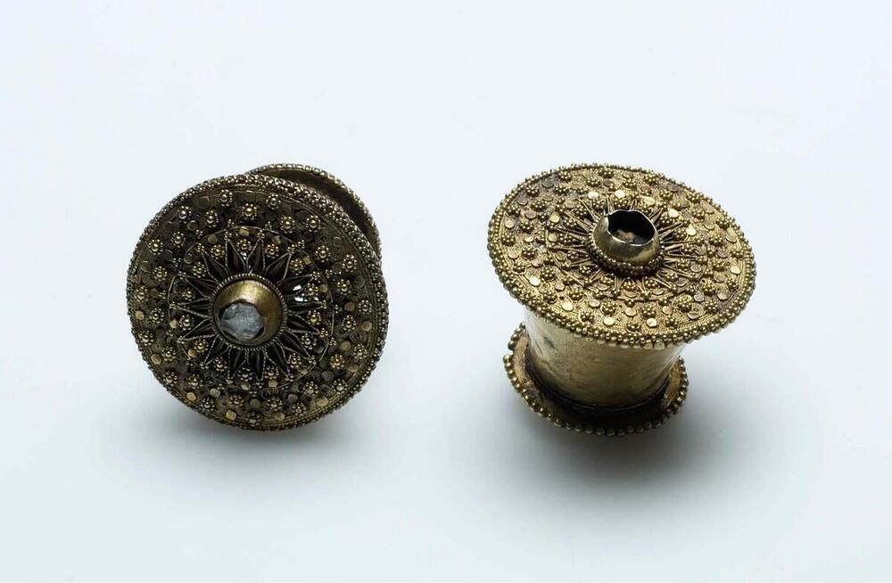 Pair of  gold-plated, silver earrings worn by women