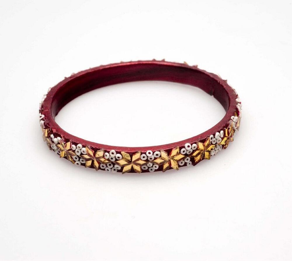 Armband van schellak met kralen en goudkleurig glas