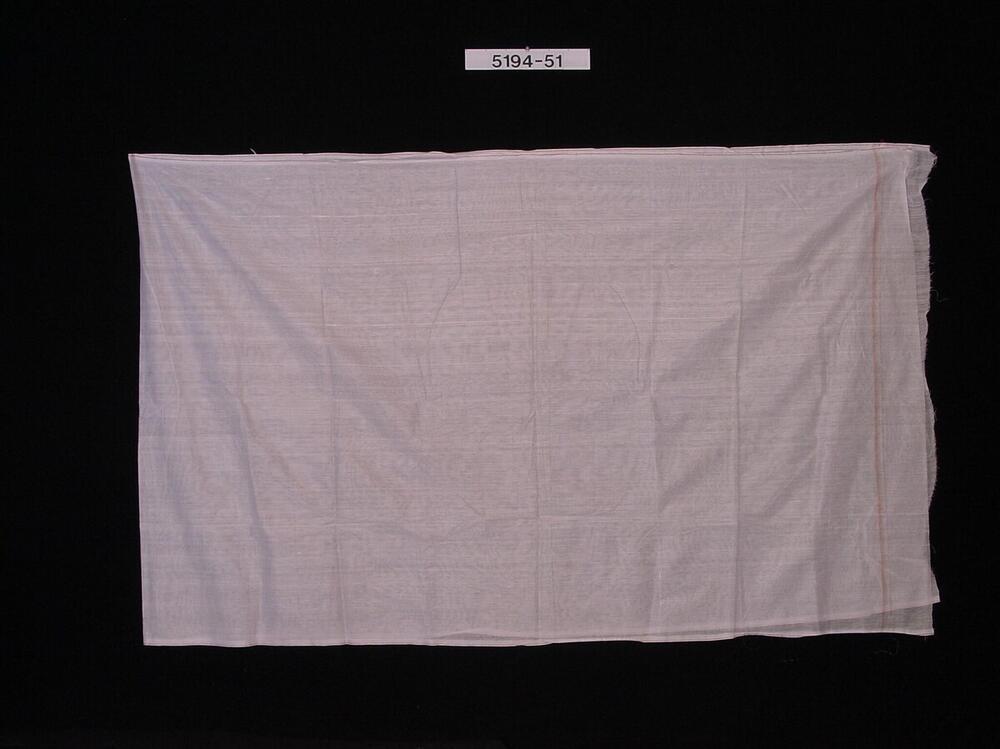 Dunne witte wikkeldoek dat tussen de benen doorgehaald en als een broek gedrapeerd wordt