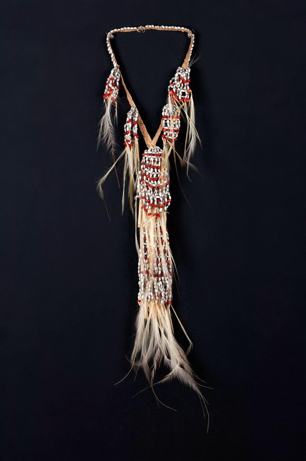 Decoration for a man having hunted more than one human head