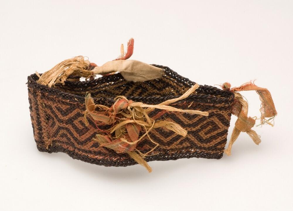 Bracelet of braided mycelium and red pandanus fibre