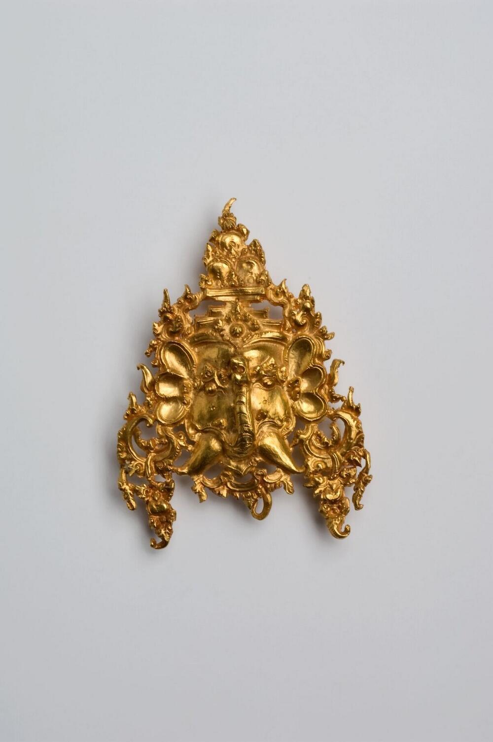 Gouden sierstuk met olifantenkop