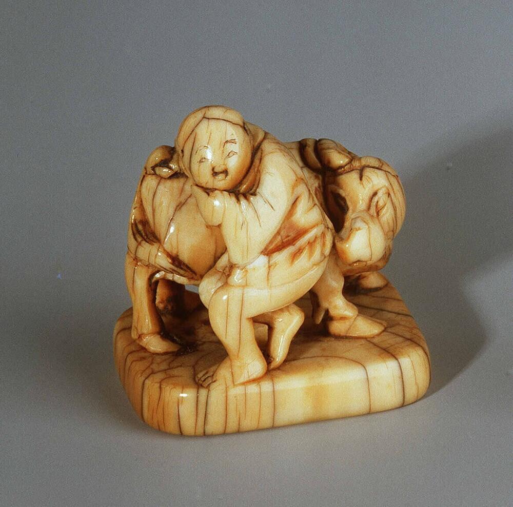 Netsuke: farmer and ox