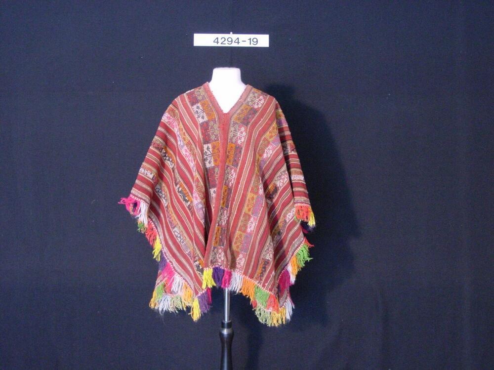 Poncho met ingeweven ster- en dierfiguren
