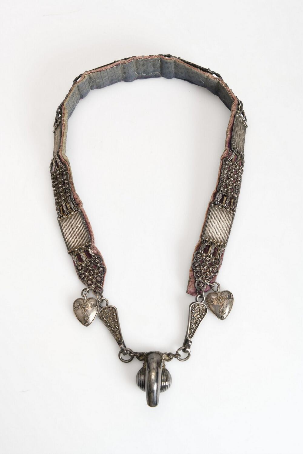 Silver ornament worn around the hips by little boys