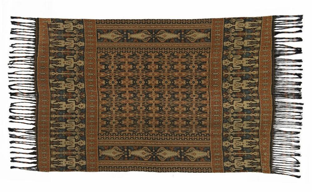 Man's cotton shoulder or hip cloth with pattern of male figures and the tree of life, ikat on warp…