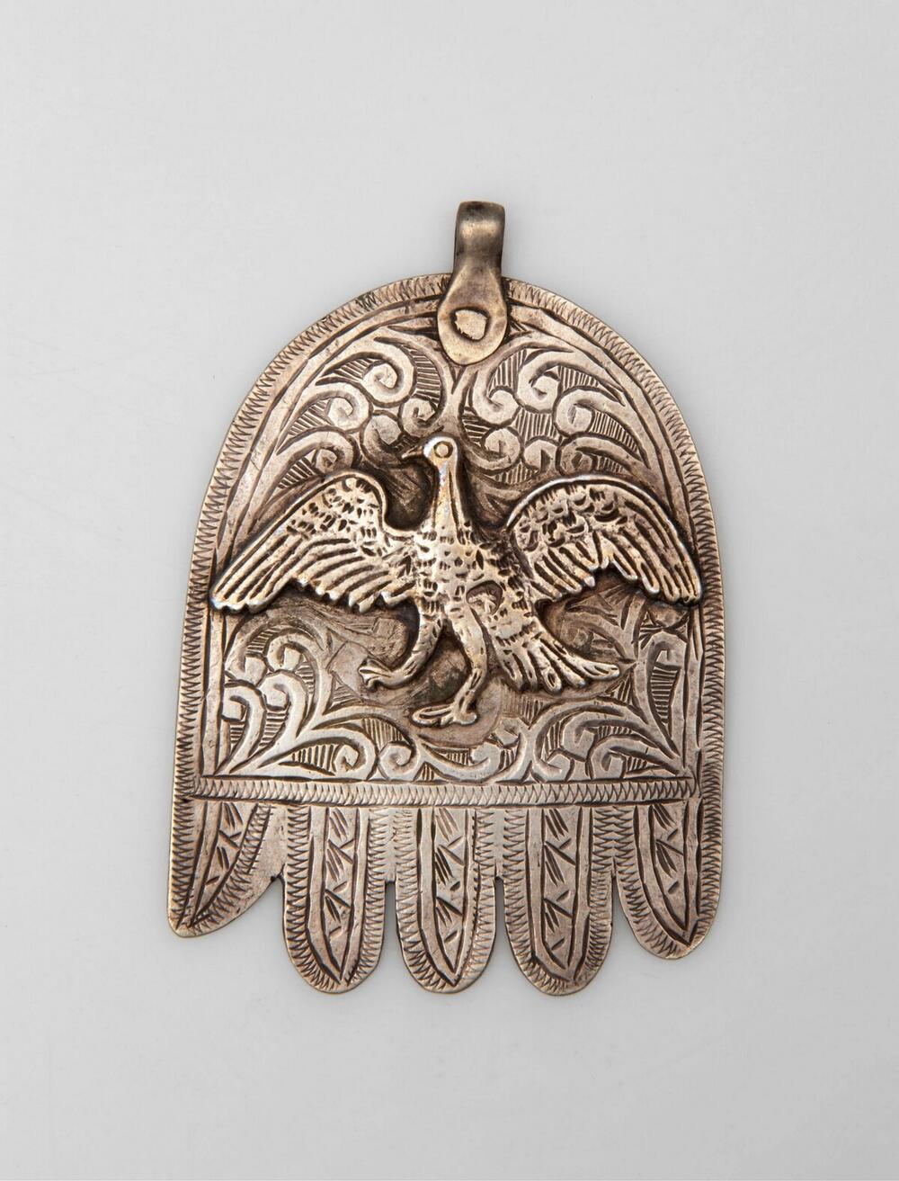 Amulet in de vorm van een gestileerd handje