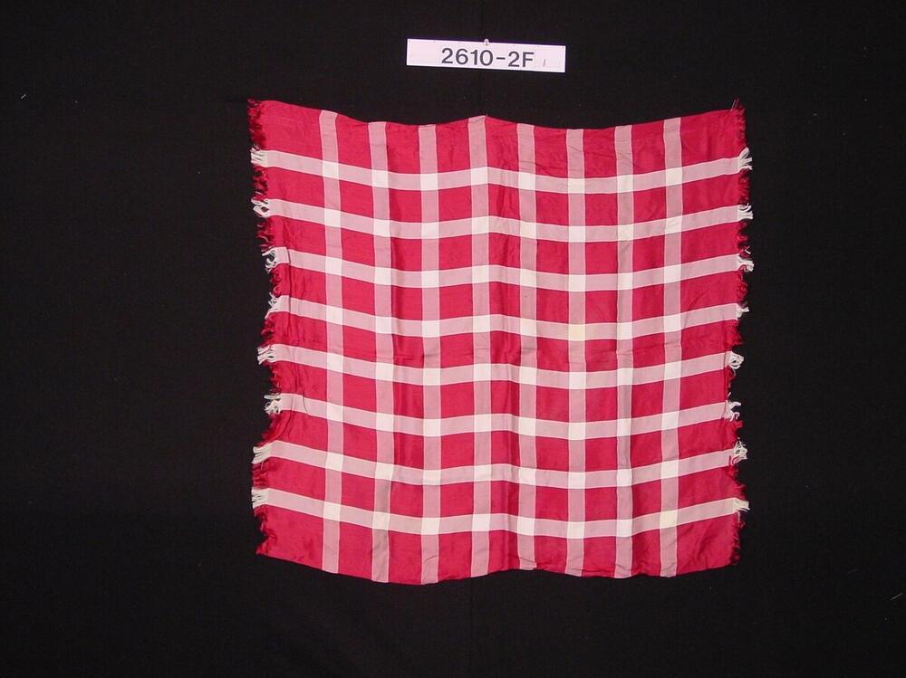 Rood-wit geruite halsdoek als onderdeel van het kostuum van een veedrijver