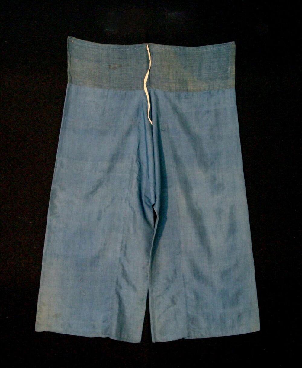 Broek van blauwe zijde met wijde pijpen