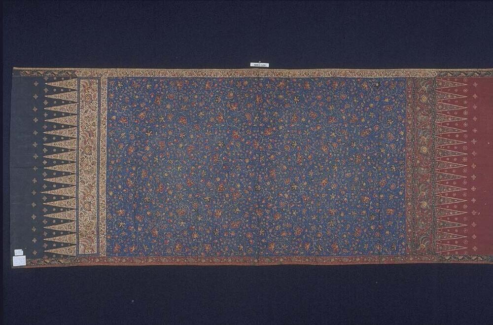 Wikkelrok vol kleine bloemen en bladeren en met verschillend gekleurde uiteinden