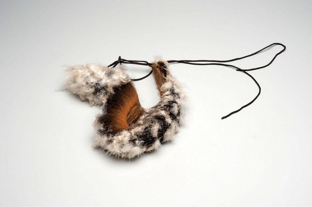 Headdress with down and the tail of a Capuchin monkey