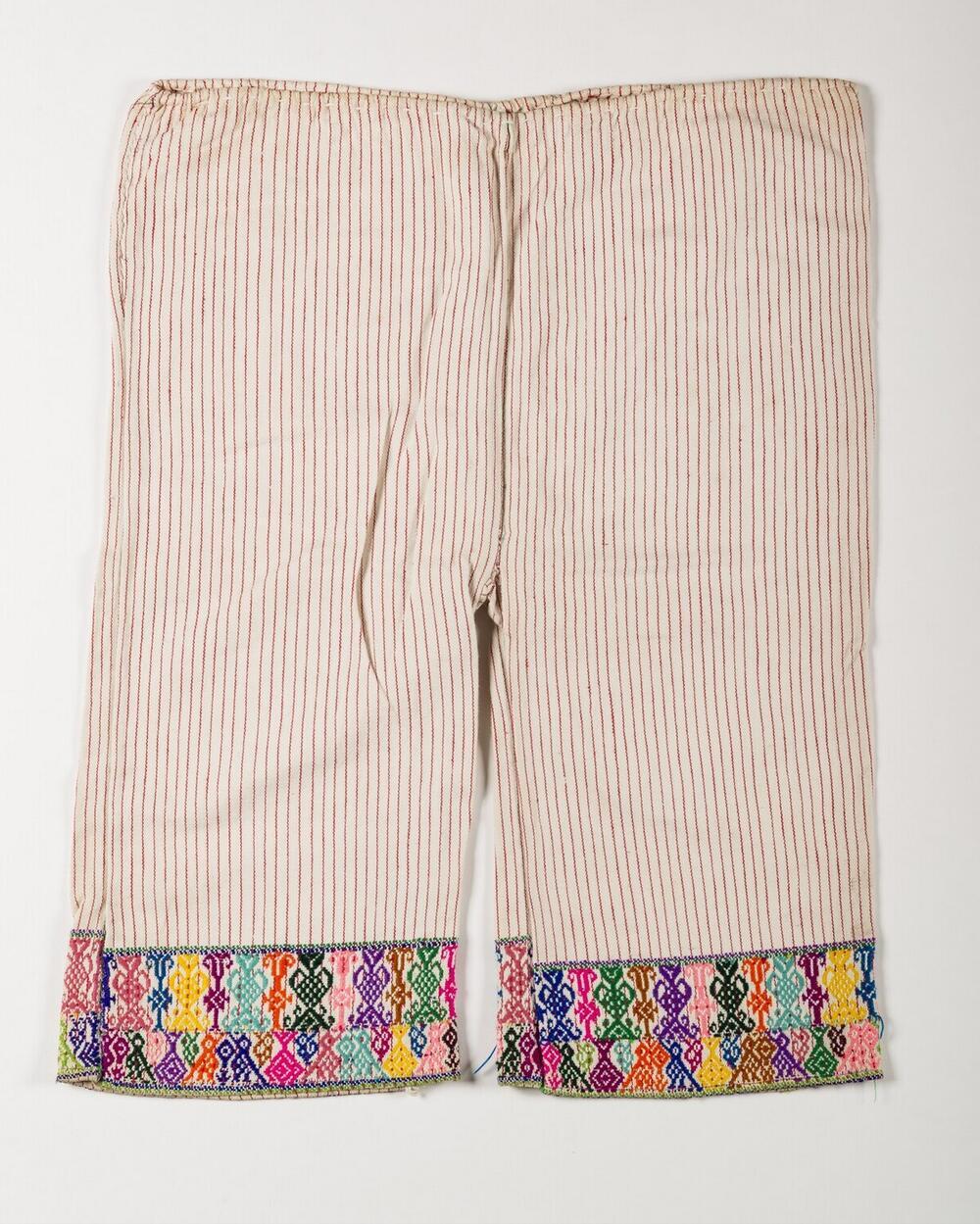 Witte broek met vogel- en plantmotieven