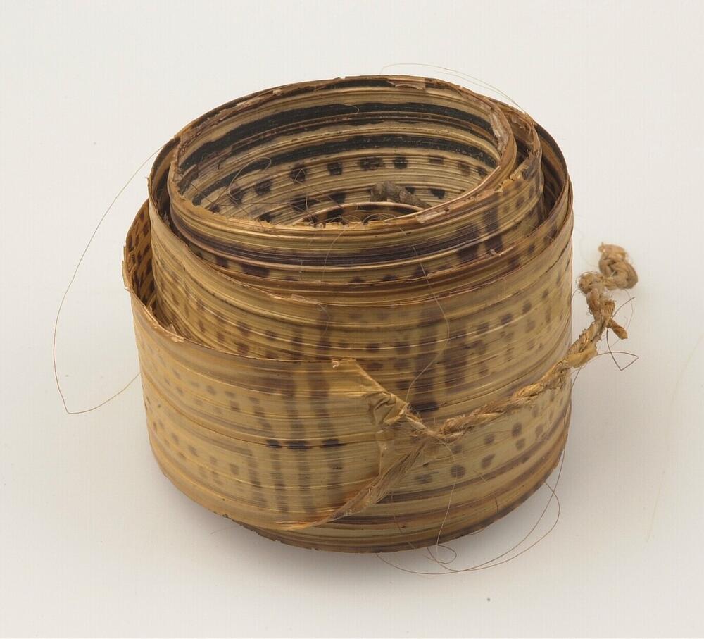 Upper arm decoration made of palm leaf