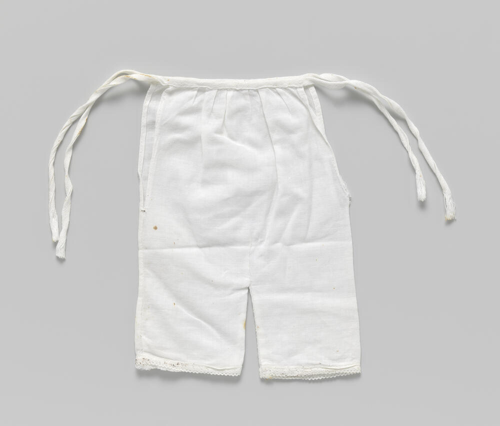 Broek met lange pijpen en versierd met stroken
