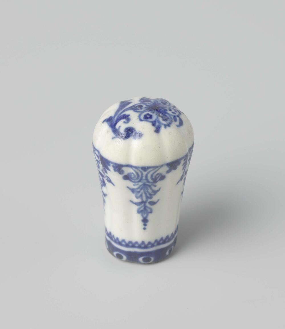 Cane knob with a flower and ornamental borders