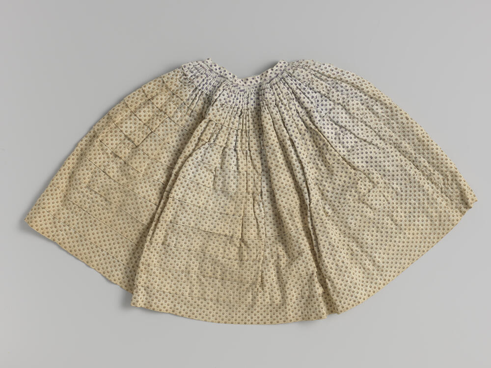 Rok of crinoline met stippen en tien oprijgen.