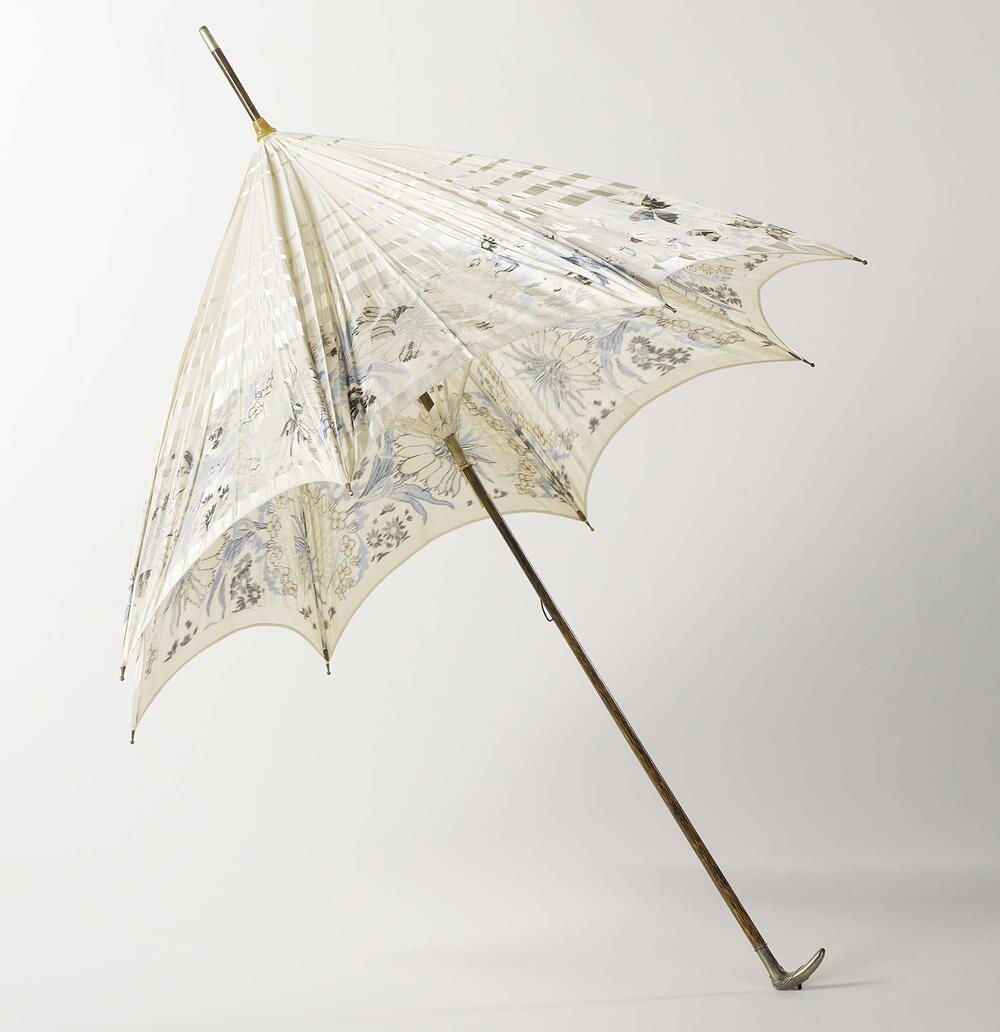 Parasol with woven motif of flowers and butterflies