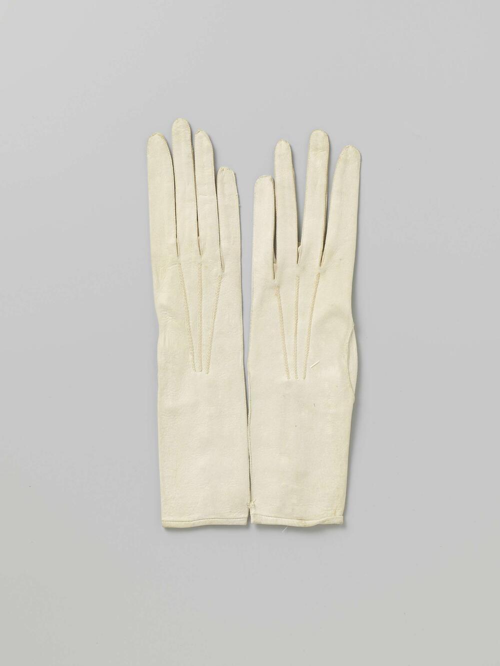 Two pairs of gloves with buttons