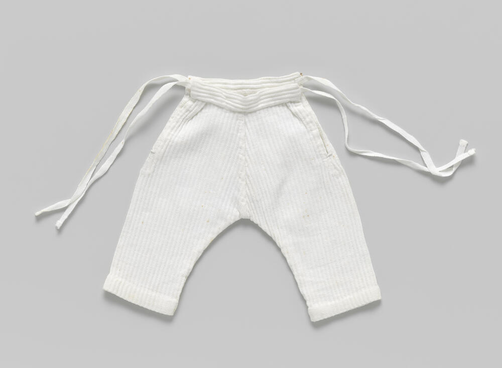 Broek van piqué, met lange pijpen en met banden