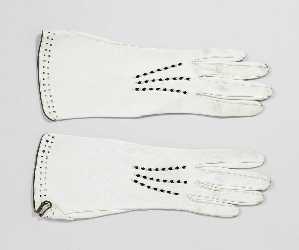 Pair of gloves with embroidered seams