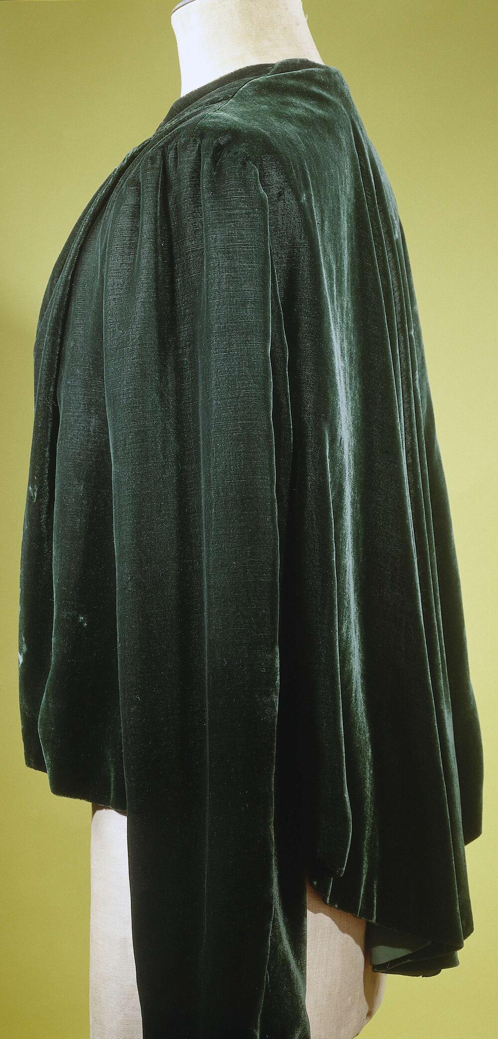 Avondjasje van flessengroene velours chiffon