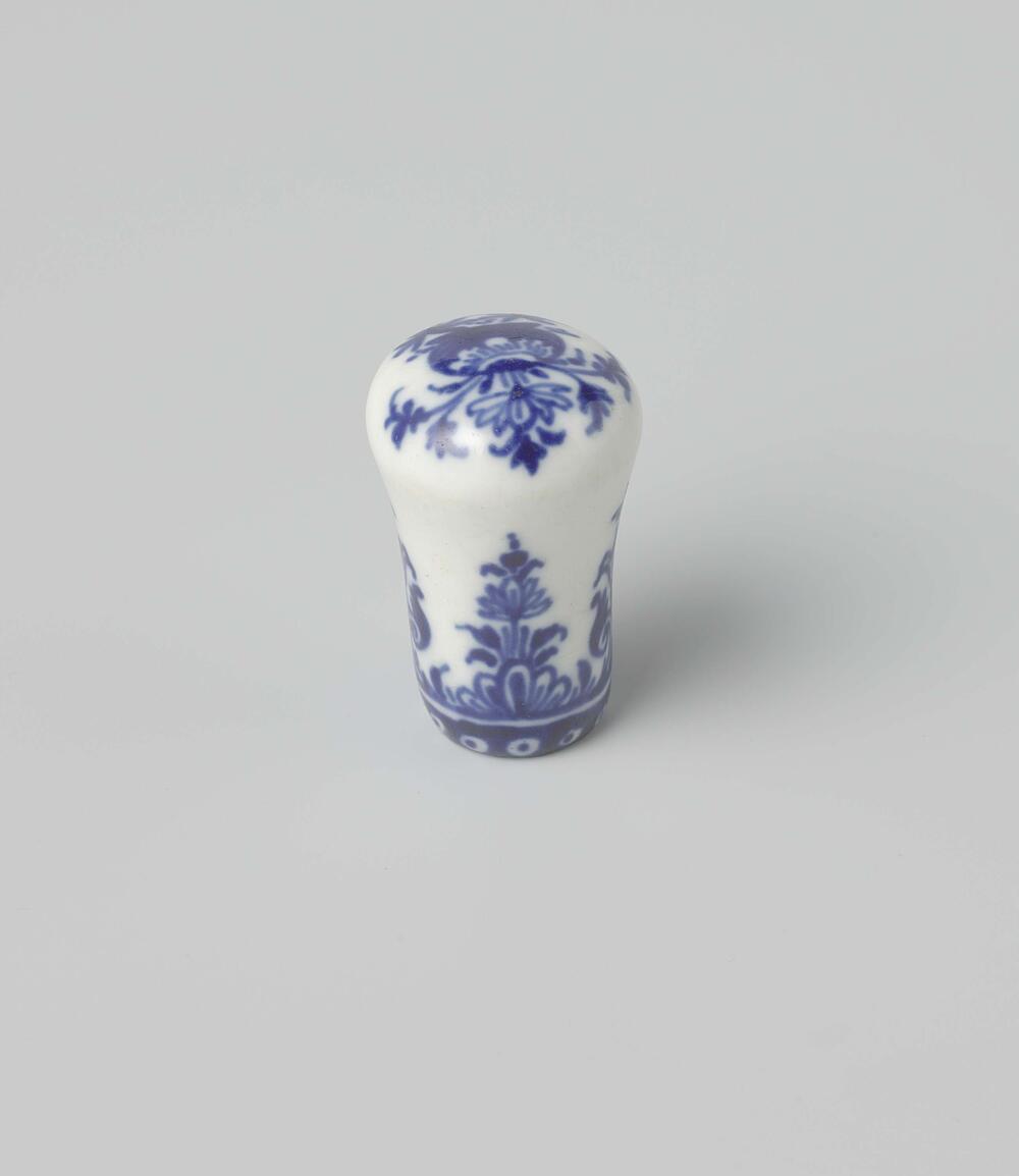 Cane knob with a flower vase and floral scrolls