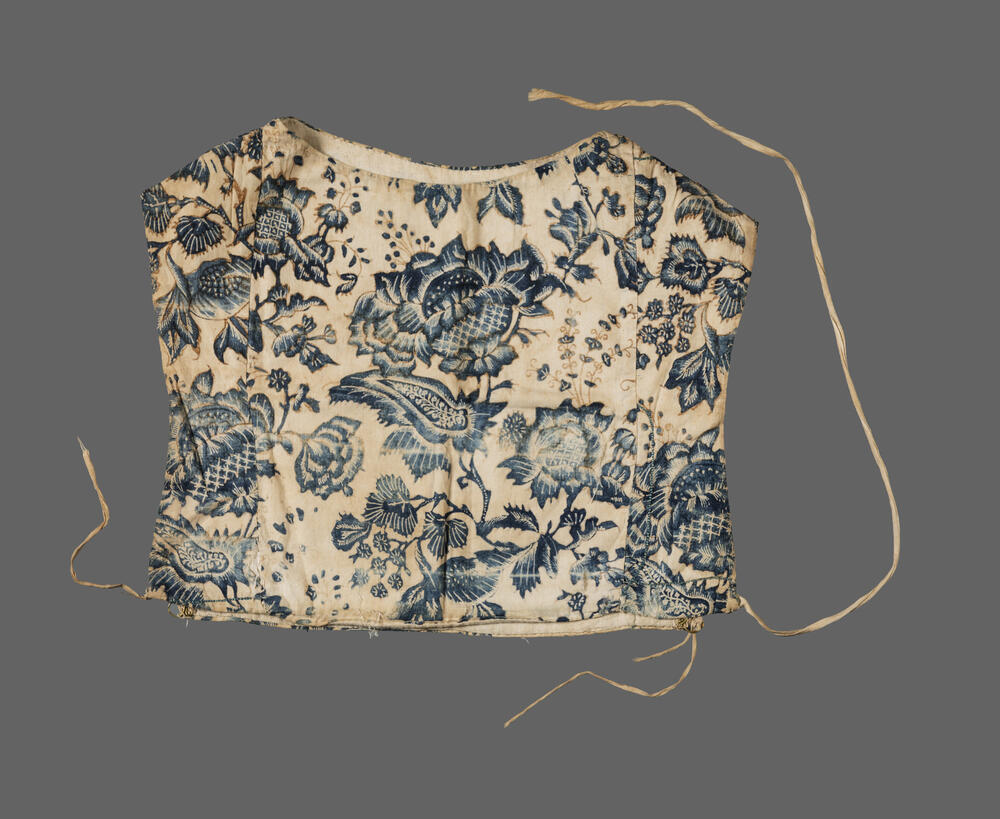 Kraplap van sits in blauw