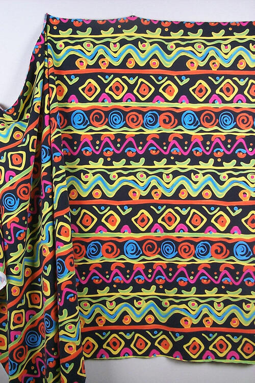 Zwarte, rekbare stof met dessin in felle kleuren
