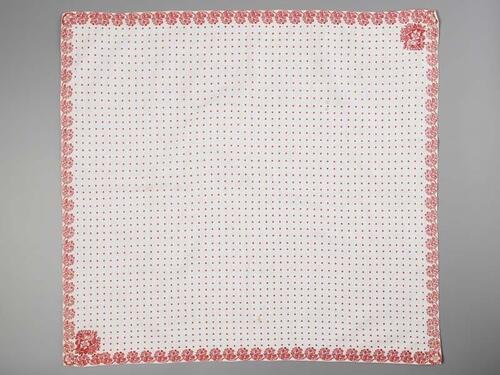 Wit katoenen sjaal met ingeweven roze rand van boeketjes en twee hoekmotieven