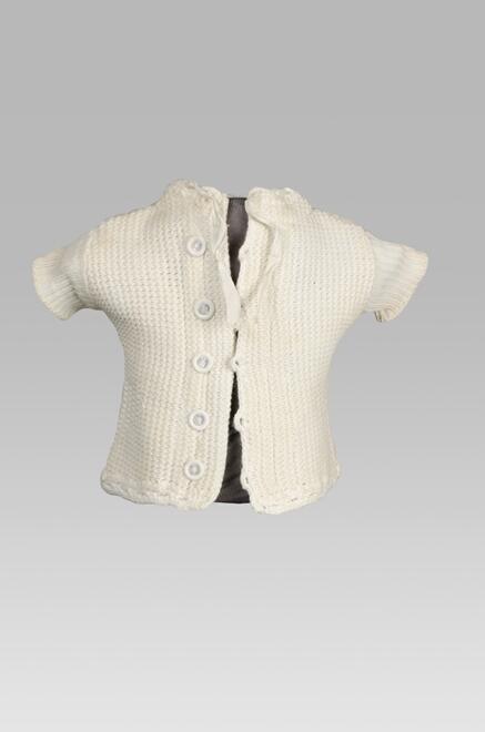 Katoenen baby borstrok van machinaal breisel met zigzag ribbelpatroon