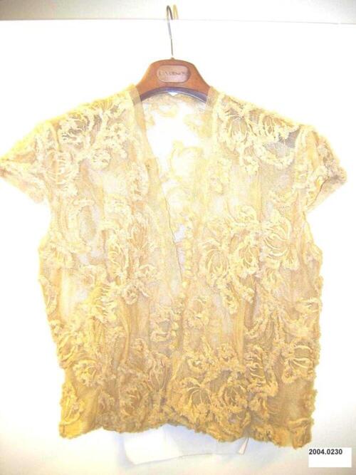 Blouse in beige tule met raffia