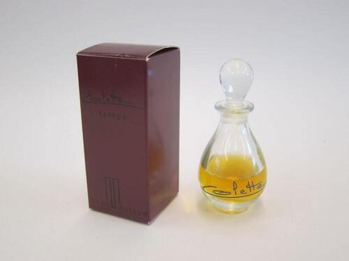 Ensemble bestaande uit duppelvormige parfumfles in doorzichtig glas en parfumdoos