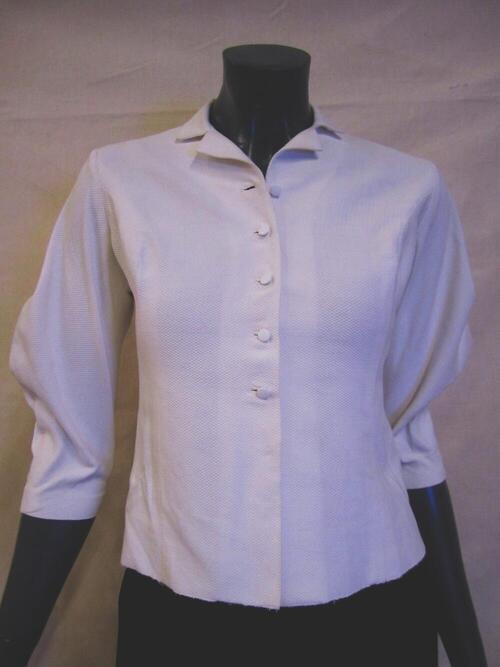 Blouse van witte katoenen piqué