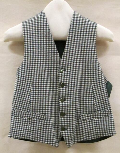 Vest (man) van wollen stof met wit/groen/zwart pied-de-poule ruitje, achterpand en voering van…