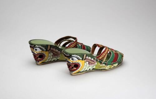 Leather mules with dragon shaped heels