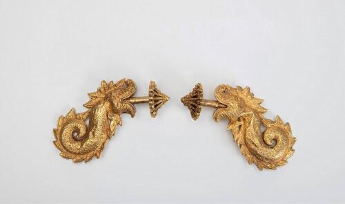 Gold ear ornament, part of a pair, with accompanying decorative screw