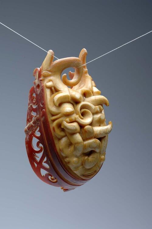 Earring made from the beak of a helmeted hornbill (Rhinoplax vigil)