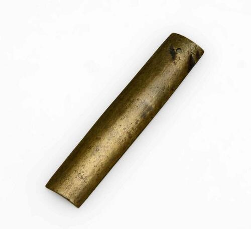 Copper ear decoration made of a cartridge