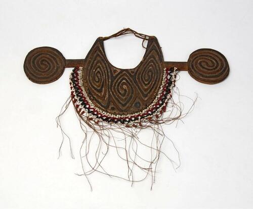 Man's breast ornament made of wood