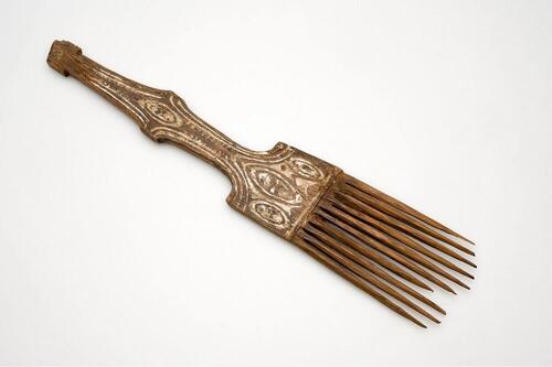 Wooden comb with decorative carvings