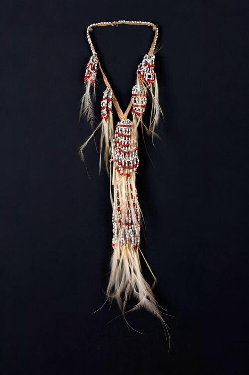 Decoration for a man having hunted more than one human head