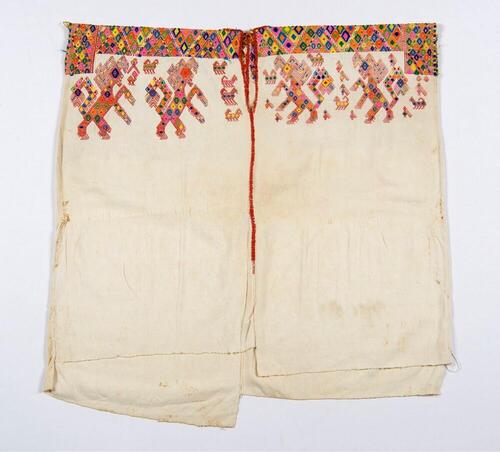 Witte huipil met leeuwmotieven