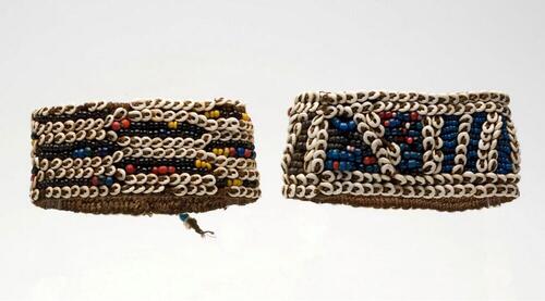 Bracelets for the upper arm, worn by a man