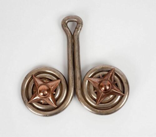 Silver ear ornament worn by women