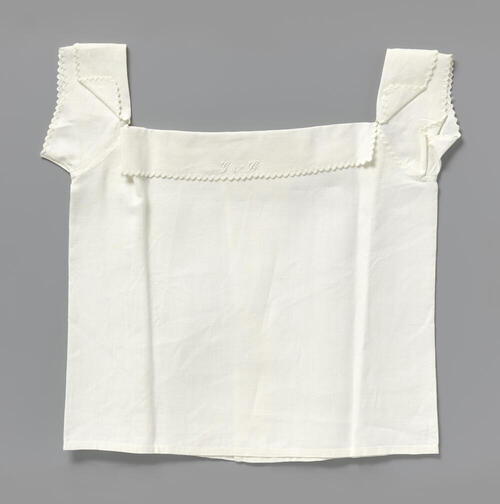 Witte onderbroek met strikken van lint op de heupen